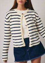 Load image into Gallery viewer, Woman wearing a striped cardigan over a white shirt and denim skirt on a plain background