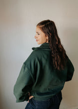 Load image into Gallery viewer, Person wearing a green jacket against a plain background