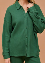Load image into Gallery viewer, Green textured cardigan worn by a person on a beige background