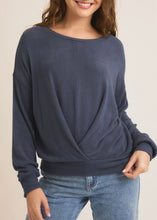 Load image into Gallery viewer, Person wearing a navy sweater and jeans on a beige background