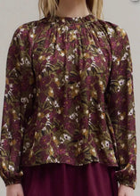 Load image into Gallery viewer, Floral patterned blouse with long sleeves on a plain background