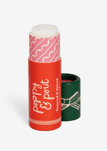 Load image into Gallery viewer, Lip balm with red packaging and white text on a white background
