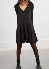 Load image into Gallery viewer, Woman wearing a black dress and black boots on a white background