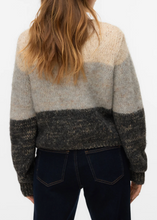 Load image into Gallery viewer, Person wearing a patterned sweater with a neutral color scheme on a white background