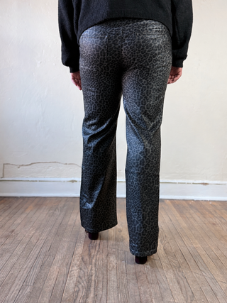 Grey and black coated leopard print straight leg pants by Molly Bracken, shown laid flat with waistband and full length legs visible.