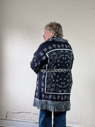 MABLE bandana fringe longline cardigan with boho style, featuring fringe details and a relaxed fit, shown on a model.