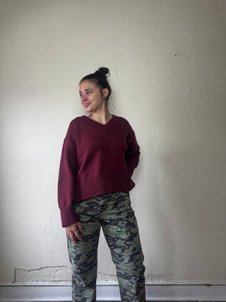 MOD REF Bordeaux Weekend V Neck Sweater, soft knit fabric in deep red, close-up of the V neckline and cozy texture.