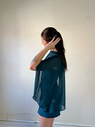 LE LIS satin slip dress with a cape overlay, featuring a sleek, elegant design perfect for formal or evening wear.
