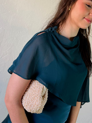 LE LIS satin slip dress with cape overlay, featuring elegant draping and smooth fabric for a sophisticated look.