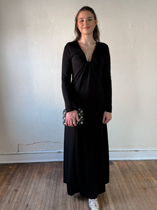 Stevie Jane After Dark Ruched Maxi Dress in black, fitted with ruched details and flowing length, photographed on a model.