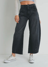 Load image into Gallery viewer, Person wearing black wide-leg jeans and white sneakers on a plain background
