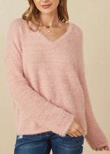 Load image into Gallery viewer, Person wearing a pink sweater and blue jeans against a beige background

