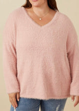 Load image into Gallery viewer, Person wearing a pink sweater and blue jeans against a beige background
