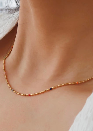 18K Petite Beaded Necklace by FLÂNERIE BY MAIQ featuring delicate gold beads on a fine chain.