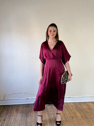 Maroon satin kimono sleeve midi dress by Sunday Edition by Le Lis, shown hanging with smooth fabric and elegant drape.