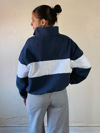 Buttermelon Heritage Gingham Colorblock quarter zip sweatshirt in vibrant red and navy with a relaxed fit and stylish design.