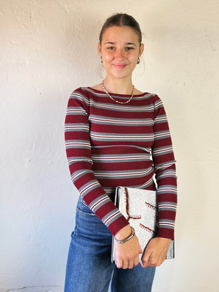 Burgundy striped boat neck pullover by THE WORKSHOP STUDIO, lightweight and casual, shown on a model.