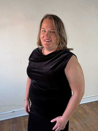 Black Stevie Jane sleeveless velvet midi dress with ruched details, extended size, and elegant fit featured in the image.