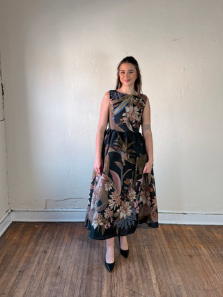 Flying Tomato Midnight Garden Midi Dress displayed on a hanger, showcasing floral pattern and elegant midi length.