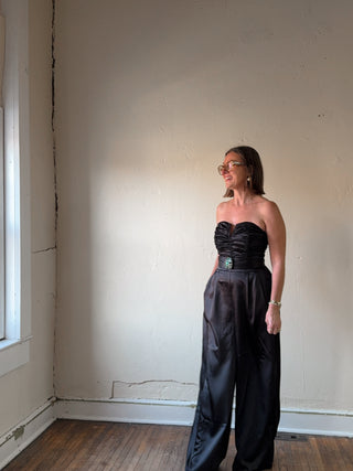 Black strapless satin wide-leg jumpsuit by Flying Tomato, featuring a sleek fit and elegant design for stylish occasions.