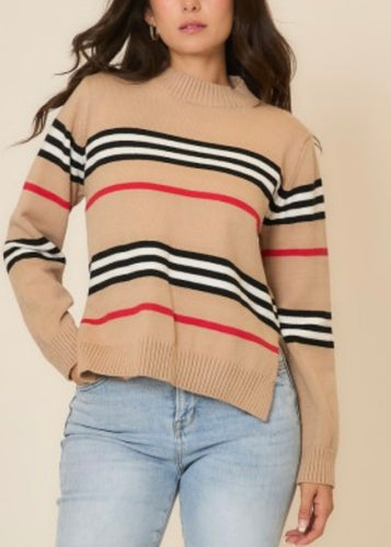 Beige sweater with black and red stripes worn by a person on a beige background