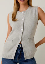 Load image into Gallery viewer, Woman wearing a gray sleeveless knitted vest against a plain background
