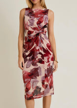 Load image into Gallery viewer, Woman wearing a sleeveless dress with red and beige floral pattern on a plain background
