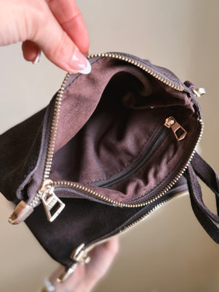 Most Wanted USA chocolate brown suede wristlet bag with compact zip closure and soft textured finish
