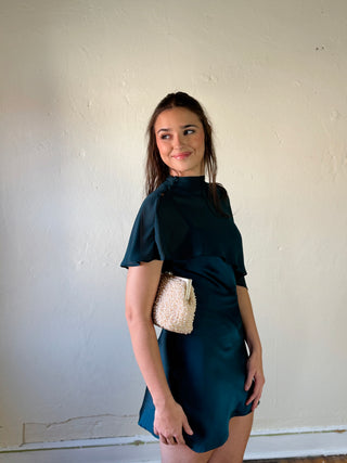 LE LIS satin slip dress with cape overlay, elegant and lightweight, featuring smooth fabric and a flowing design.