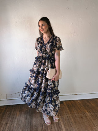 Bluebell Romance floral tiered maxi dress by BLU PEPPER, featuring a flowing fabric and vibrant bluebell floral pattern.