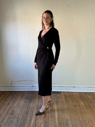 Black surplice wrap long sleeve midi dress by SUNDAY EDITION BY LE LIS, featuring a stylish silhouette and elegant design.