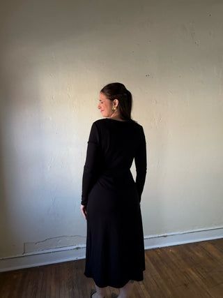 Black Surplice Wrap Long Sleeve Midi Dress by SUNDAY EDITION BY LE LIS, showcasing its elegant wrap design and long sleeves.