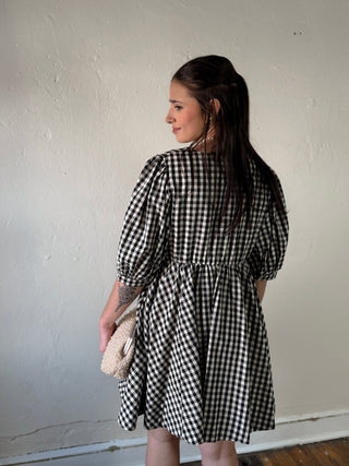 MOD REF Aileen Gingham Babydoll Dress DMIN, lightweight fabric with black and white gingham pattern, flowy fit, and feminine style.