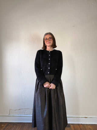 Black fuzzy pearl button cropped cardigan by FLYING TOMATO with pearl buttons and a cozy, textured knit design.
