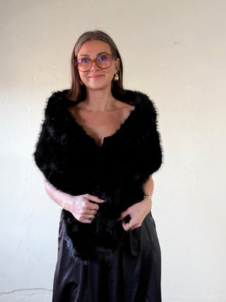 Black faux fur capelet shawl by FWJK from FASHION CITY, shown draped over a mannequin, highlighting its plush texture and elegant style.