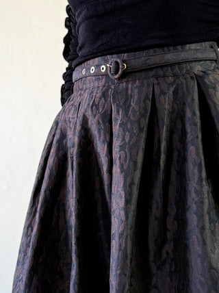 Flying Tomato animal print brocade pleated midi skirt in brown, showcasing its textured fabric and elegant design.