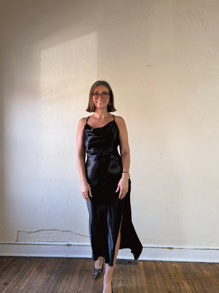 Black satin slip dress from HYFVE's Wardrobe Hero collection, featuring a sleek, elegant design with thin straps and smooth fabric.