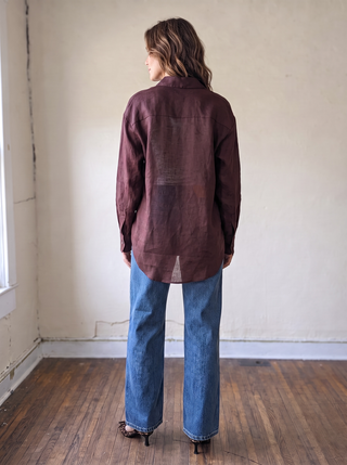 OLIVACEOUS LGSLV Everyday Linen Button Down Shirt in natural beige, casual fit with collar and long sleeves, displayed on a hanger.
