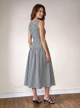 Black checked gingham midi dress by BLU PEPPER, featuring a classic pattern and midi length, displayed on a hanger.