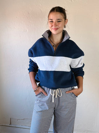 Buttermelon Heritage Gingham Colorblock quarter zip sweatshirt in light and dark plaid with ribbed cuffs and collar.