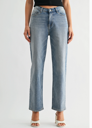 Light blue jeans worn by a person on a white background