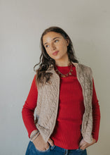 Load image into Gallery viewer, Woman wearing a red sweater and beige vest against a plain background
