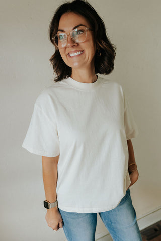 Tan Rommy Tee by THE BLANK LAB, a stylish bone-colored T-shirt with a relaxed fit and soft fabric.