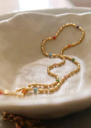 18K petite beaded necklace by FLÂNERIE BY MAIQ featuring delicate gold beads on a fine chain.