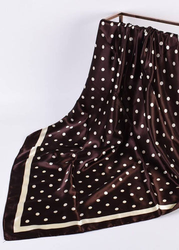 Brown scarf with white polka dots on a white background