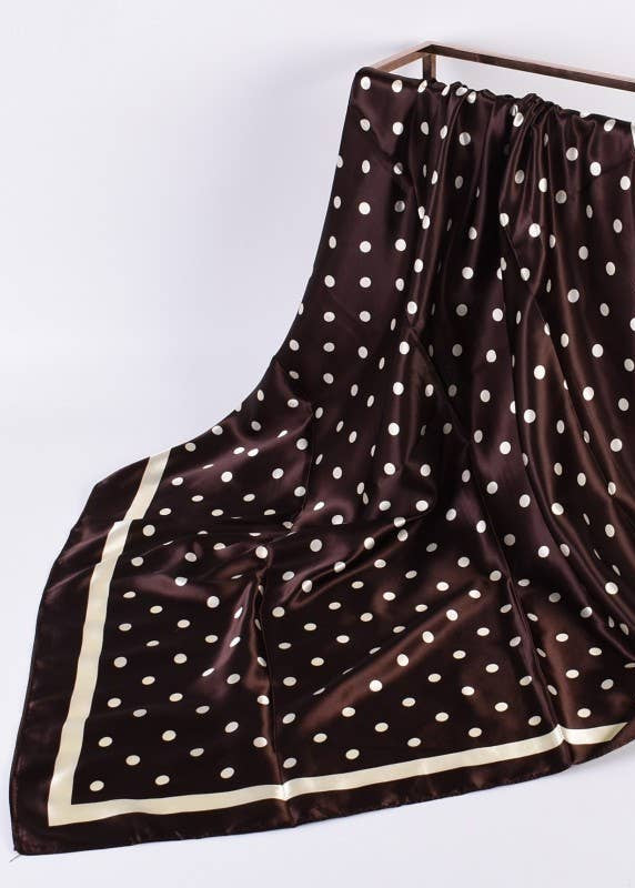 Brown scarf with white polka dots on a white background