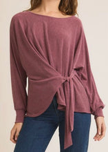 Load image into Gallery viewer, Mauve long-sleeve top with knot detail worn by a person on a plain background
