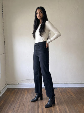 Women’s black slim palazzo denim pants by JUST BLACK DENIM with scissor cut details, showcasing a stylish, fitted design.