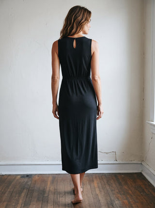SUNDAY EDITION BY LE LIS Midnight Luxe Draped Midi Dress, elegant black dress with flowing fabric and draped design, front view.