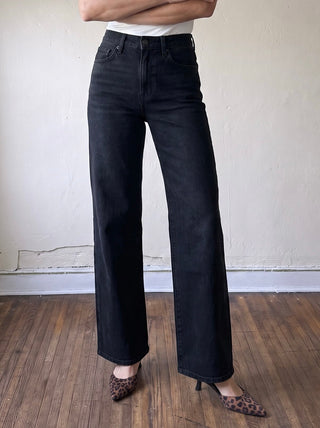 Just Black Denim women's denim jacket with classic design, shown hanging on a hanger with visible front details.
